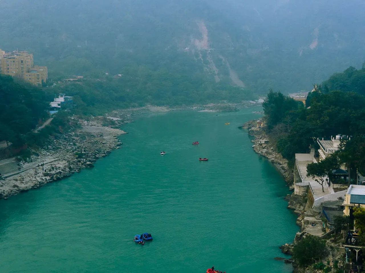 High view of the Ganga flowing through the green Rishikesh valley