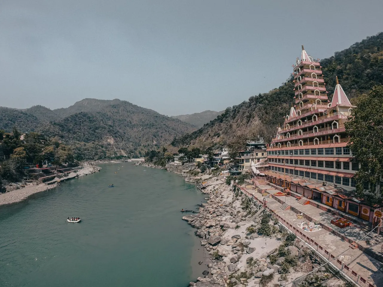 Temple complex overlooking the Ganga river and hills in Rishikesh